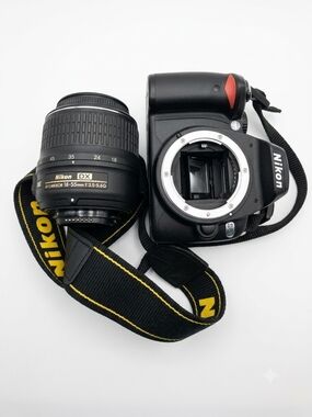 Nikon DSLR Camera Body with Black 18-55mm Lens and Black/Yellow Strap